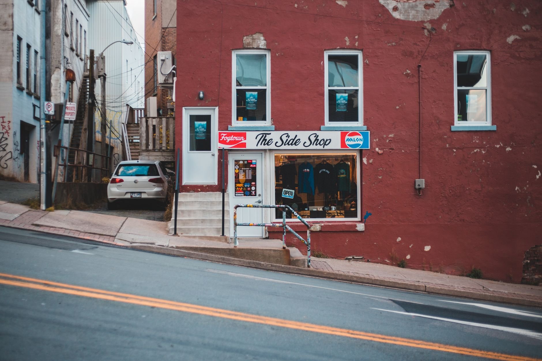 Charming storefront of a small shop on a sloped street — the kind of local business Ctrl+Alt+Design serves.